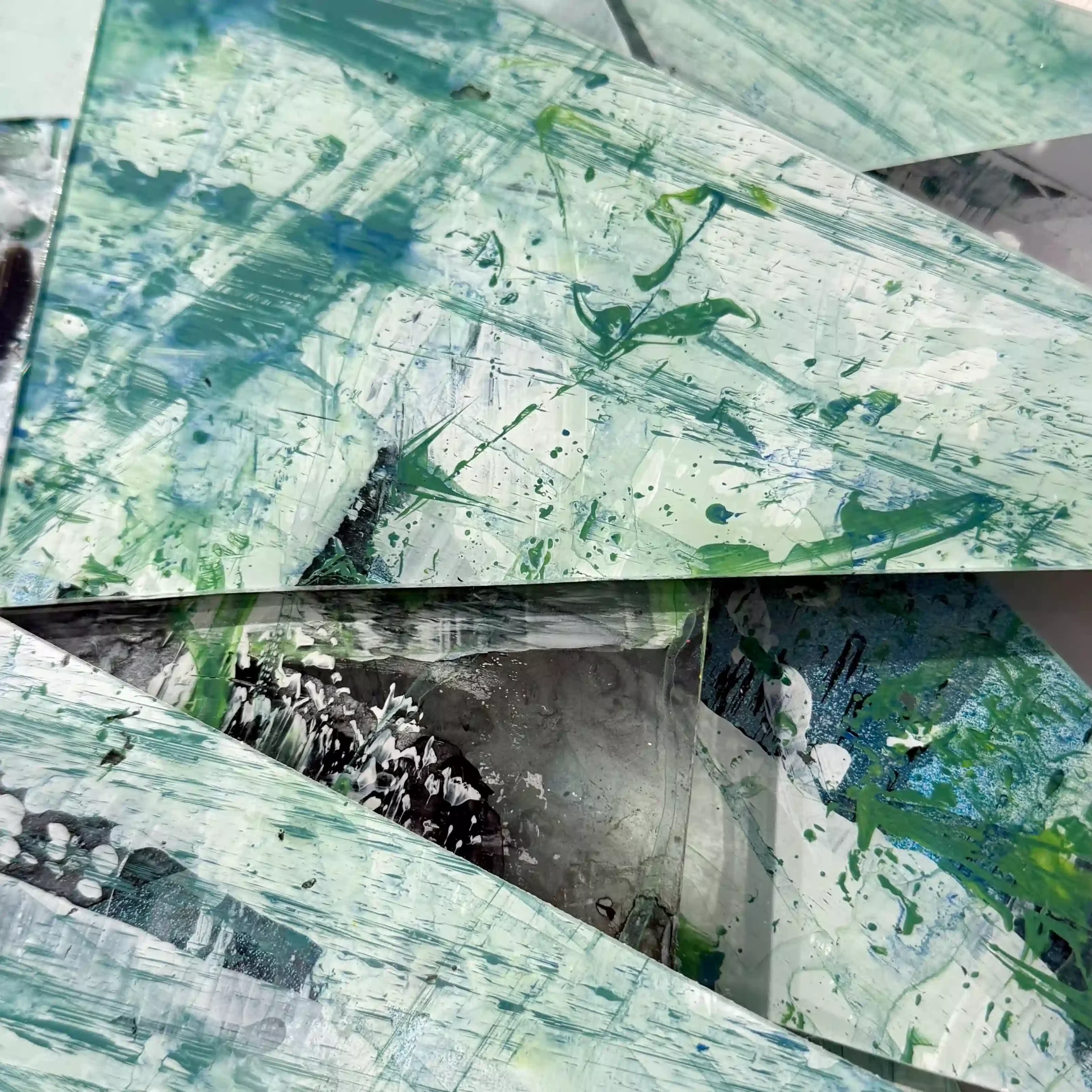 Hand painted acrylic on plexiglass sculpture by Marina Aristotel, Titled "Parts of the same you". Features irregular organic edges and layered translucent volumes. Vibrant green shades. Premium dimensional wall art for modern luxury interior and boutique hotels. slices of color